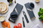Global's two vegetable slicing mandolin slicer sets with additional julienne blade attachments and protective finger guards.