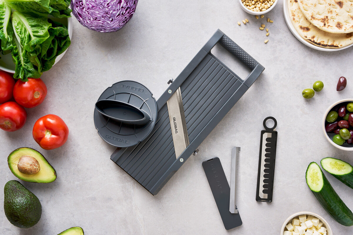Global's professional mandoline slicer kit with extra slicing blades ns safety hand protector. Blades include mandoline julienne blades, slicing blades and thin shredding blade.