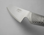 Close-up of a Global knife with a perforated handle on a grey background. Ultra sharp kitchen knife.