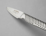 Close up of GSF-46 Peeling Knife with ultra sharp blade on a grey background