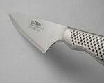 Global GS-89 Cook's Knife with a stainless steel blade and a textured, perforated silver handle, shown on a neutral grey background.