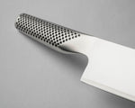 Stainless steel Global G-2 Japanese chef's knife with perforated handle for a comfortable grip on a grey background. Shows Global G-2 Japanese Cook's knife all stainless steel construction for an easy to clean kitchen knife that is hygienic for home and professional kitchens.