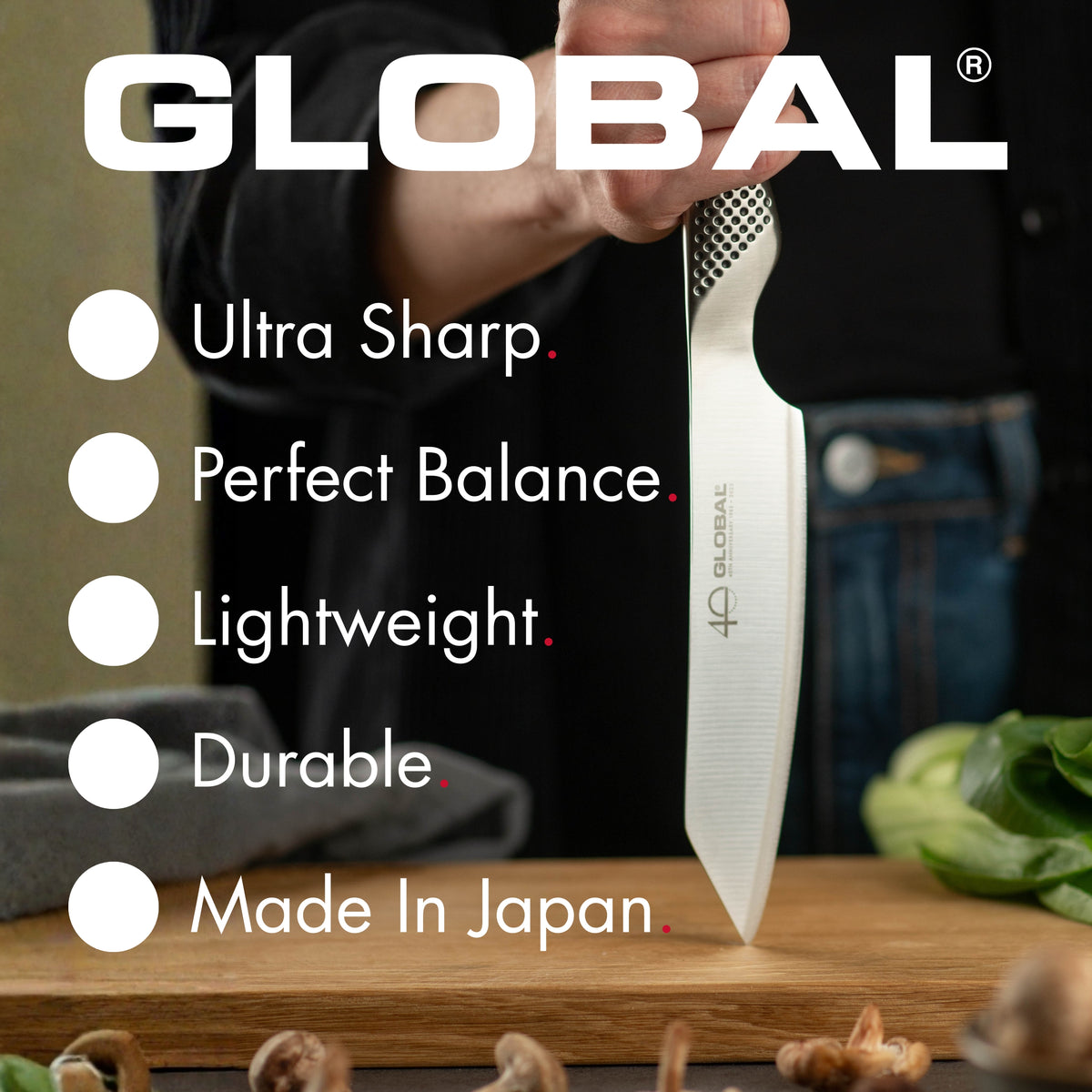 Stainless steel kitchen knife with Global branding on a cutting board, highlighting features like ultra sharp, perfect balance, lightweight, durable, and made in Japan.