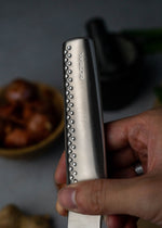 Global Ni Handle. Slightly longer handle then classic Global knives and a spine that has been marginally rounded to provide control and comfort using a pinch grip.