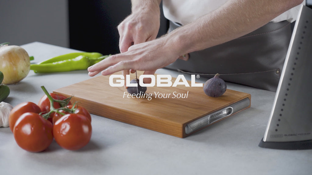 Global Cherry Wood Chopping Board video showing food preparation on the wooden cutting board. Video stated that the premium cutting boards are naturally antibacterial, kind to you knife's edge, the serving boards have the iconic dot stainless steel handle, a luxurious deep red hue. The boards are sure to stand out in any kitchen and come in 3 sizes.